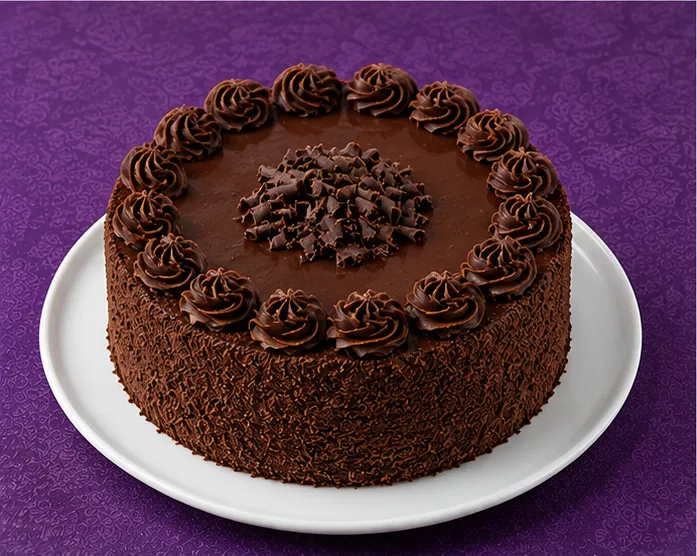 Chocolate cake with chocolate cream and curls