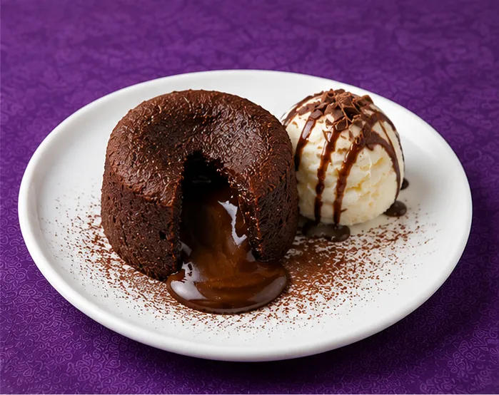 Chocolate lava cake with vanilla ice cream and chocolate sauce