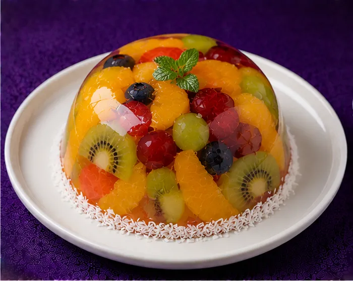 Mixed fruit jelly dessert with kiwi, orange, grapes, raspberries and blueberries